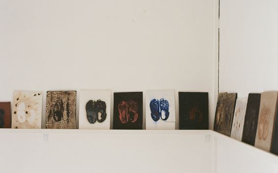 ceramic tiles with prints of them in a exhibition space