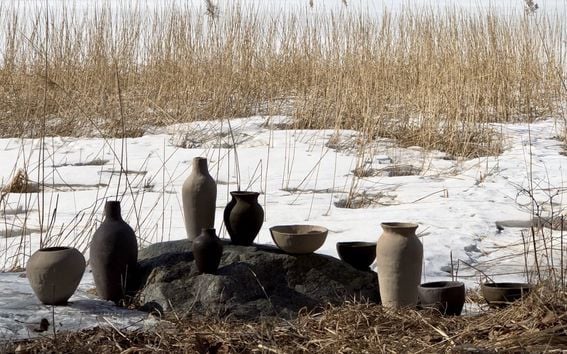 ceramic pots and vases in outdoors next to sea
