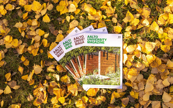 Four copies of printed magazine photographed on the yellow autumn leaves