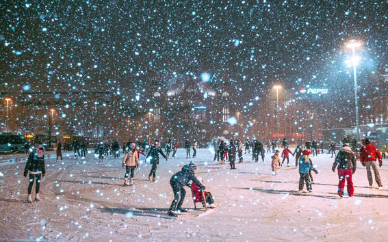 People iceskating in the snow