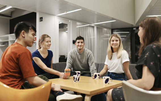 A group of students sitting around a table