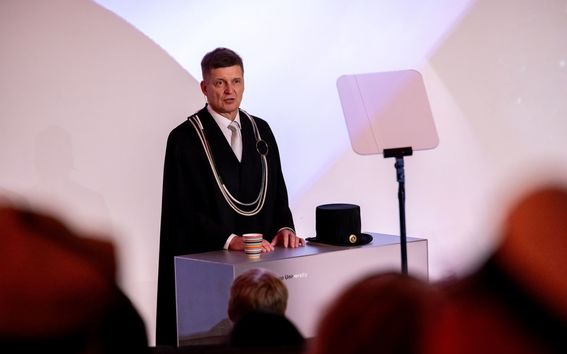 Ilkka Niemelä in his official black ceremony clothes giving speech