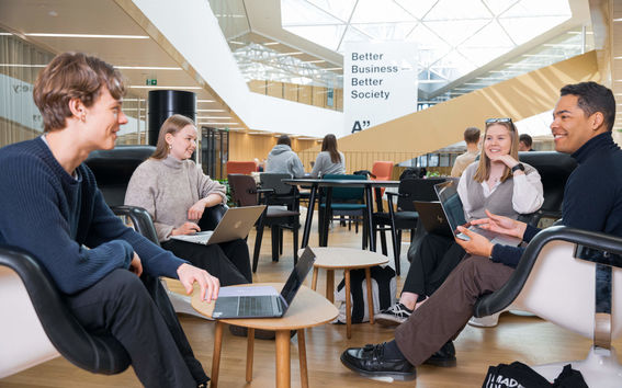 Students sitting at Aalto University School of Business