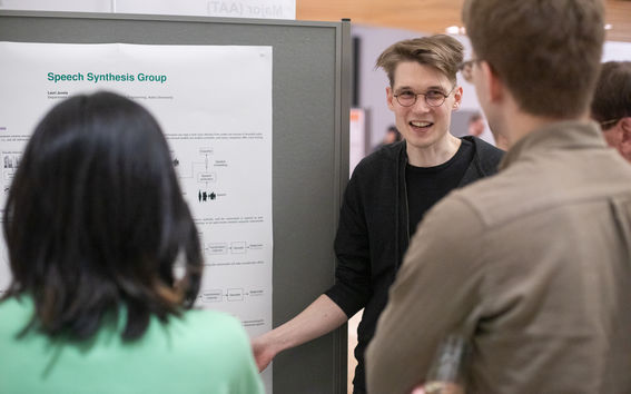 Person presenting a research poster