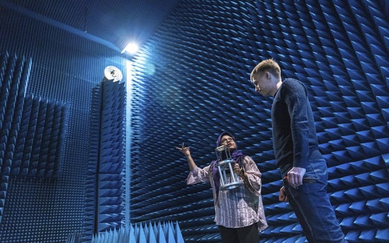 Two students in Microwave Anechoic Chamber