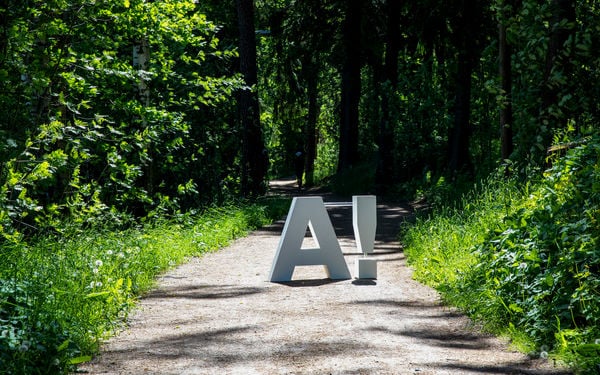 Aalto logo placed on a gravel path.