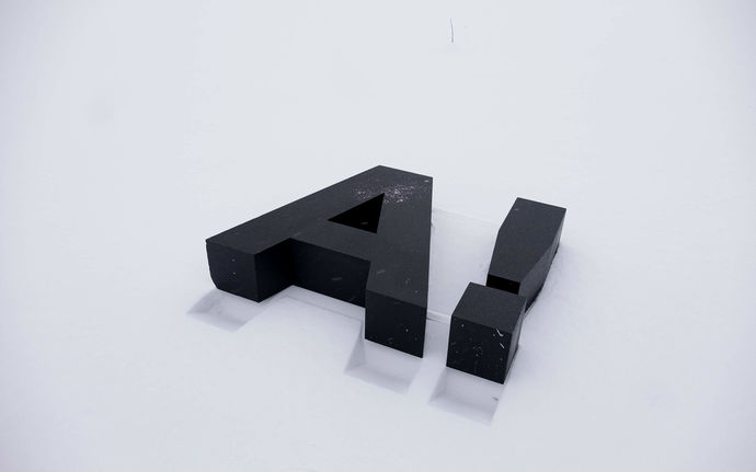 Aalto University logo A with exclamation mark on white surface