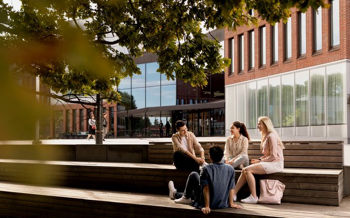 Students in front of Väre building of Aalto University campus