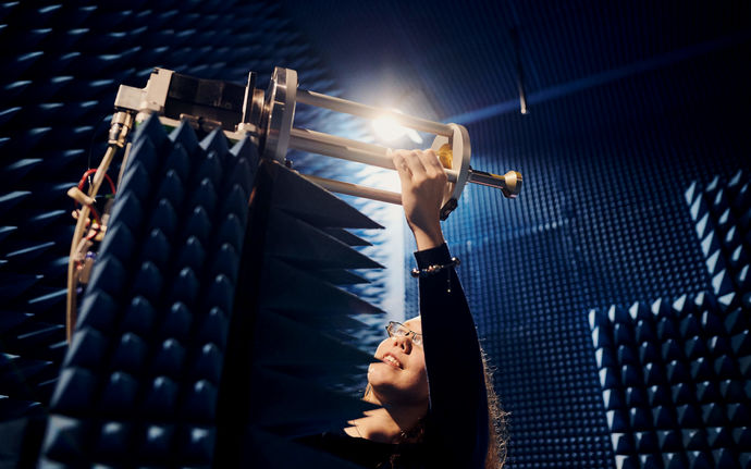 Microwave engineering student working in an anechoic chamber.