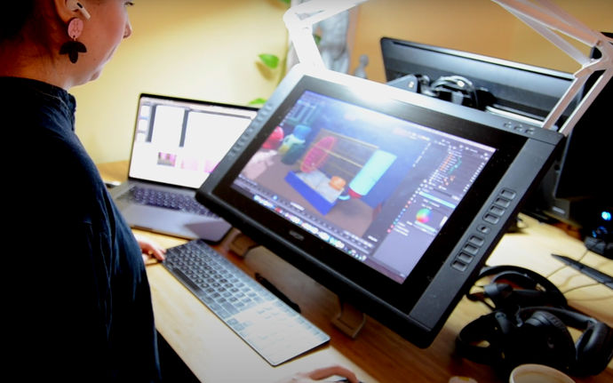 Game designer Jenni Varila working with a game design on computer. Photo from video by Mortti Saarnia.
