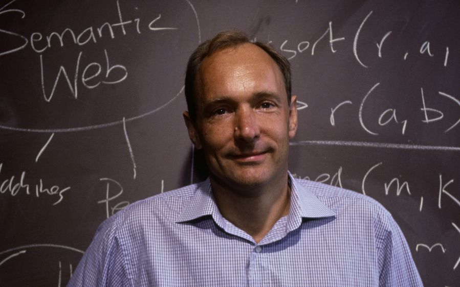 Tim Berners-Lee in front of a blackboard