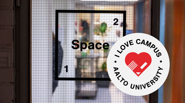A view through the door of Space 21 with their logo in view. I love campus logo badge in the lower right corner.