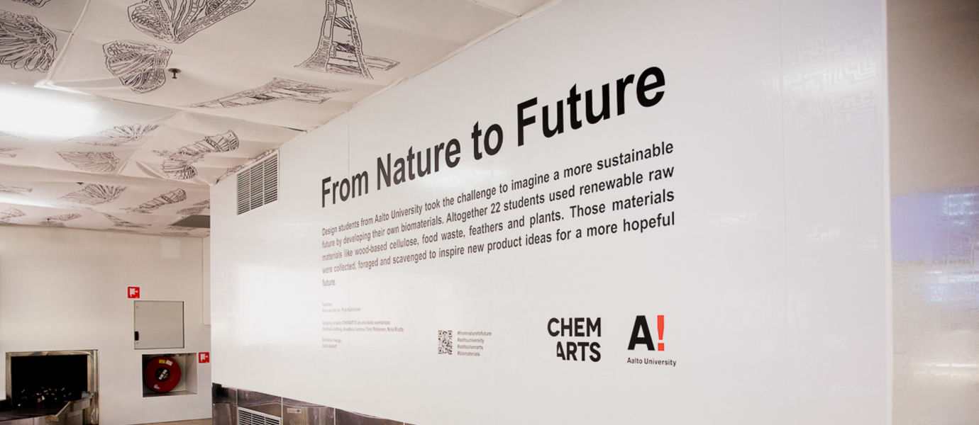 Description of the "From Nature to Future Exbition" on a white wall with black text. Photo: Eeva Suorlahti 