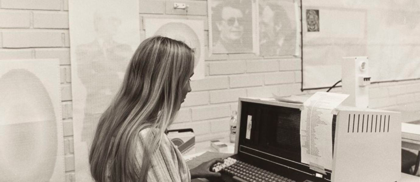 A person using a computer in a historical setting.