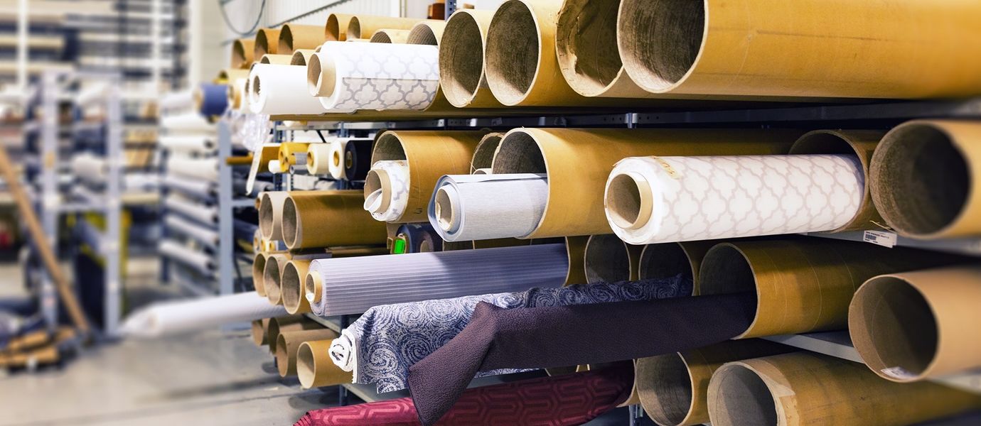 Rolls of fabric in warehouse