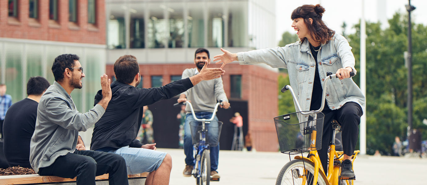 Aalto University students giving a high five