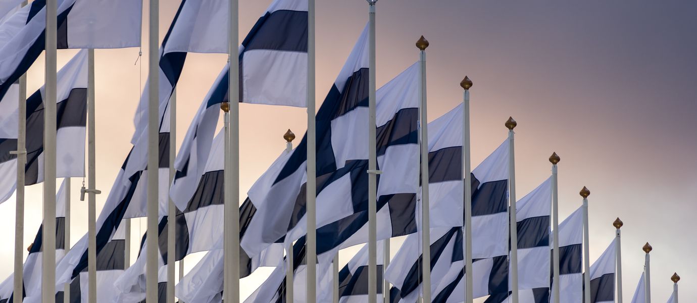 Finnish flags on gradient sky