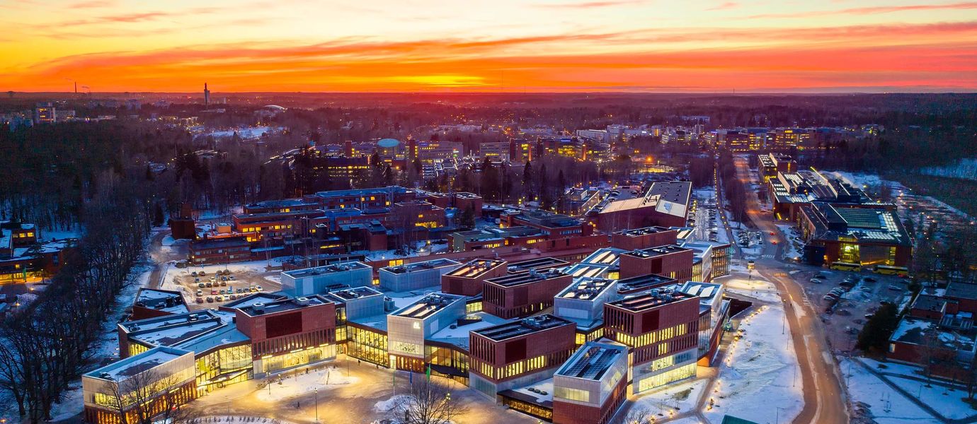 A wintery evening shoot of Aalto University campus when the sun is setting down, the School of Business main building in focus
