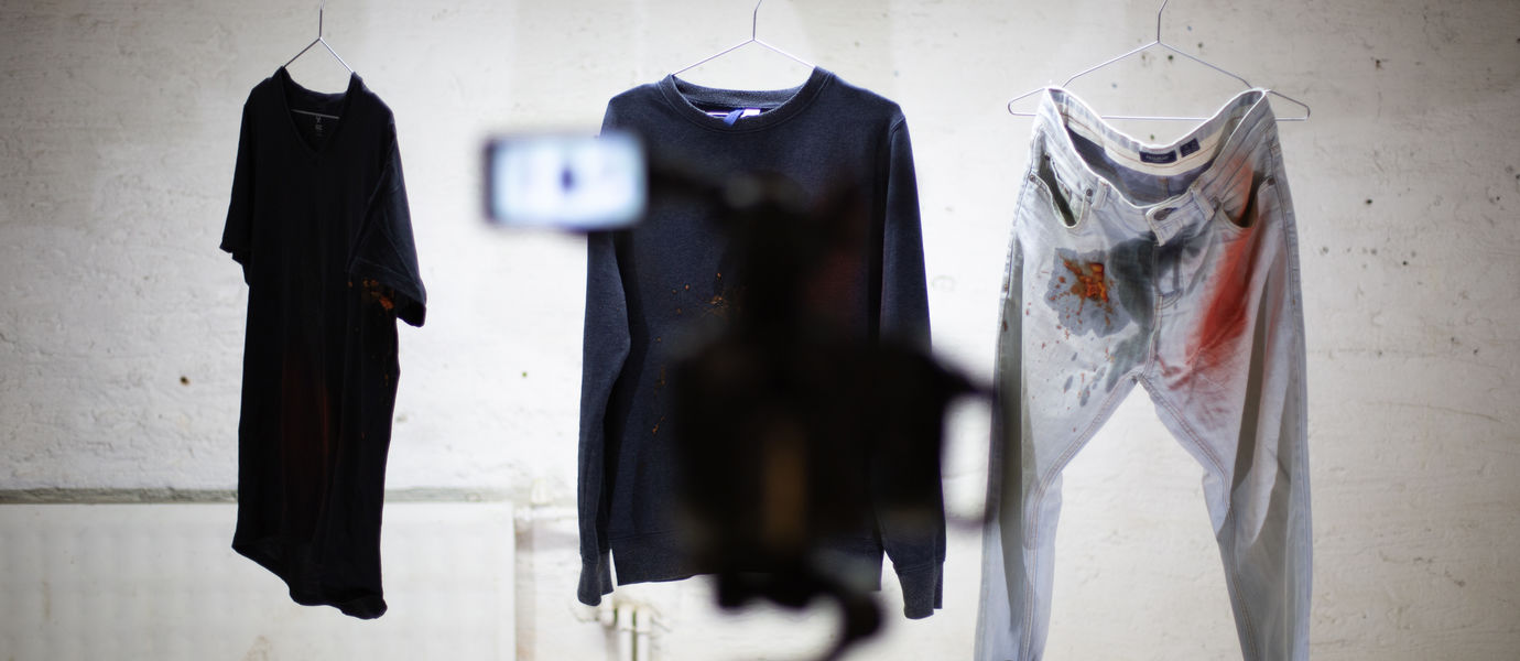 process photo of a video shoot where clothes are being tested