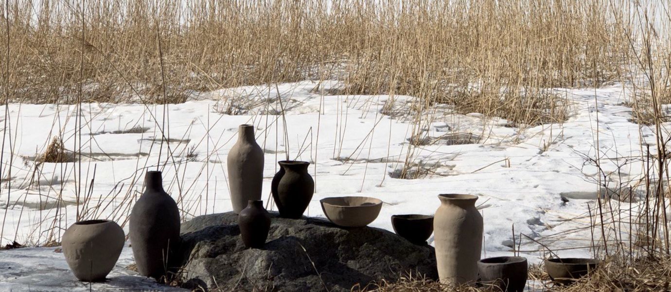 ceramic pots and vases in outdoors next to sea