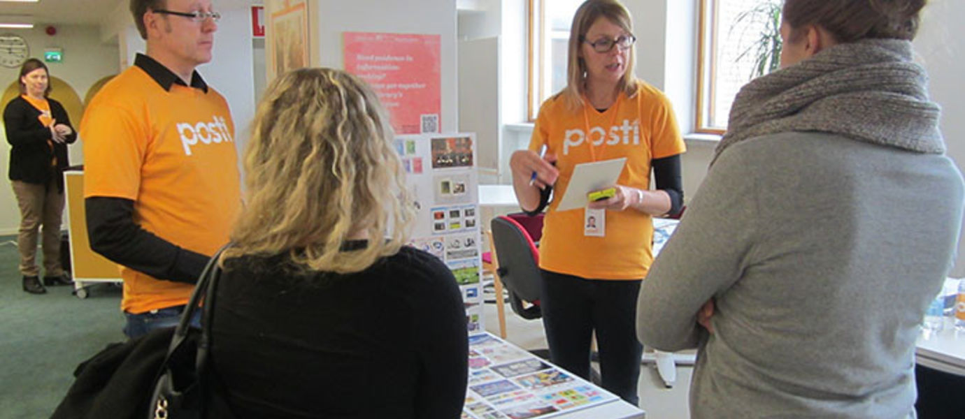 Design Manager Tommi Kantola and Communications Manager Anne Huhtala tell students about postage stamp design.