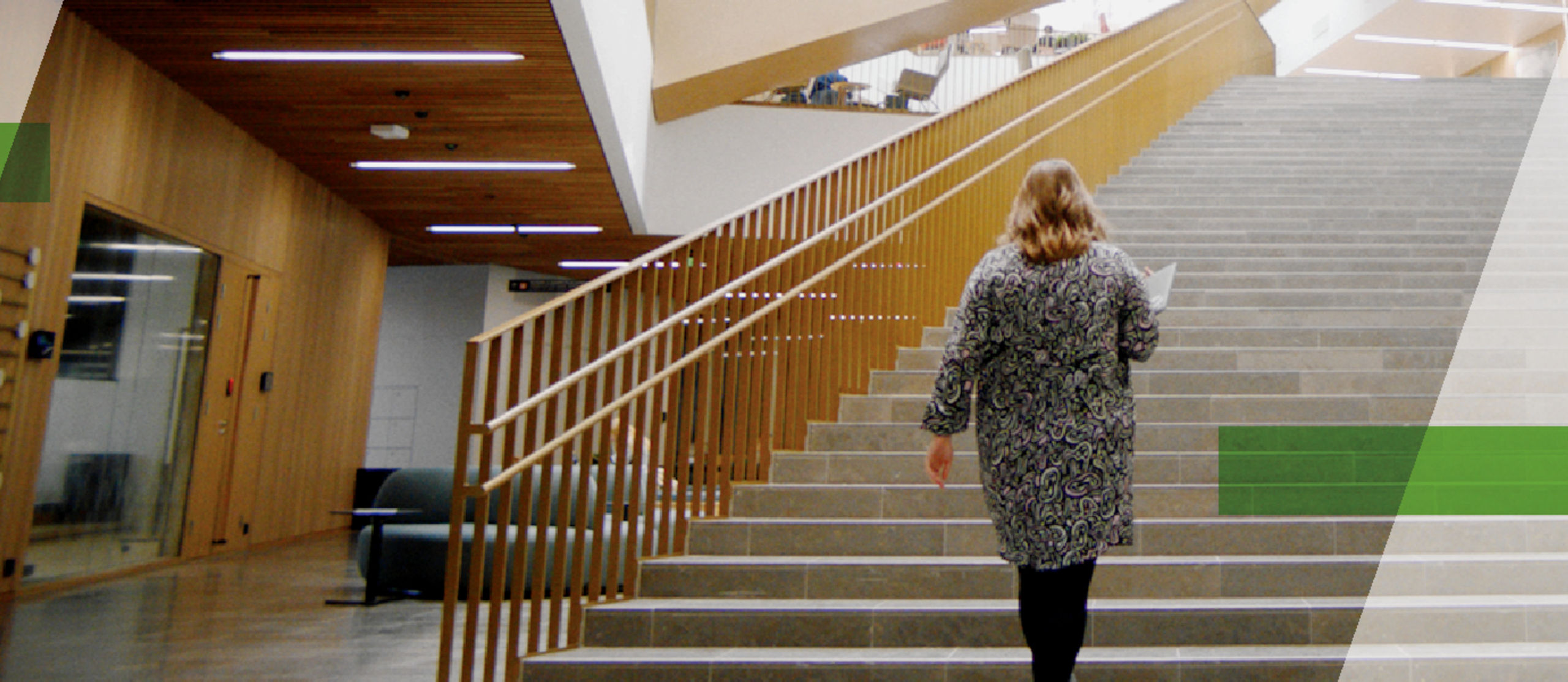 Student marketing campaign cover picture showing a woman walking in the school of business