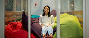 Linh Nguyen sitting in a room full of Fatboy beanbags