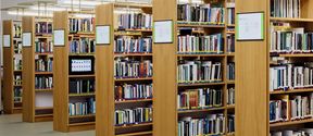 Book shelves in the library full of books