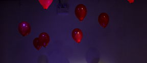 red balloons, violet lighting 