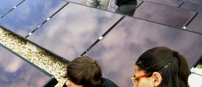 Students working on solar panels at Universitat Politecnica de Catalunya. Brand photo.