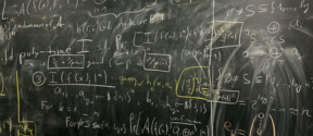Blackboard filled with figures and equations