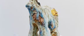 an artwork made of ceramics depicting a pony