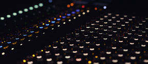 Mixing table with lights on.