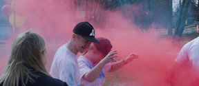 Aalto University students enjoy themselves at the color carnival