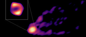 Teleskooppiverkoston ottama kuva galaksin M87 mustan aukon varjosta ja suihkusta. 