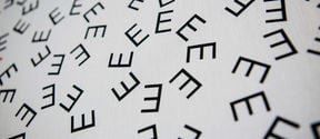 Photo of art work with letters E scattered around in different shapes