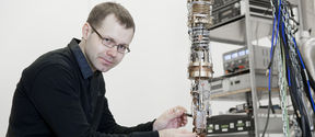 Mika Sillanpää uses a screwdriver on a piece of equipment.