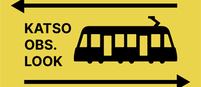 A yellow sign with the words Katso, Obs, Look, a tram icon next to them, with an arrow above pointing to left and an arrow below pointing to right. All text and icons are in black. This is part of a campaign to increase safety near the new light rail tram.