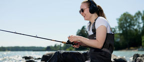 women fishing and listening a lecture