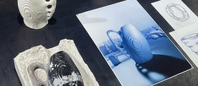 An exhibition layout presenting the mould, finished porcelain object and presentation  alongside initial sketchesposter