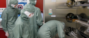 Researchers operating tube furnace in Micronova cleanroom