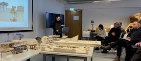 Student presenting stage proposal for Kuhmo city representatives