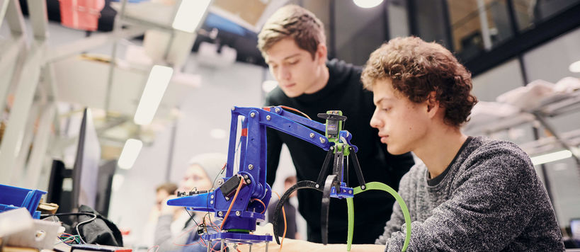 two students building a robotic device photo: unto rautio / Aalto University