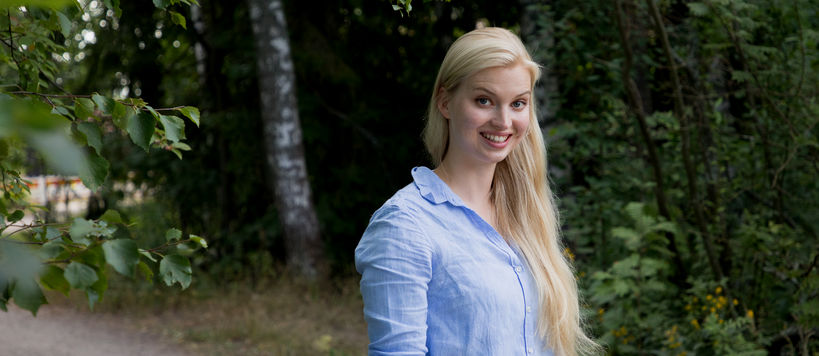 Silja Sormunen standing on a forest path in Otaniemi