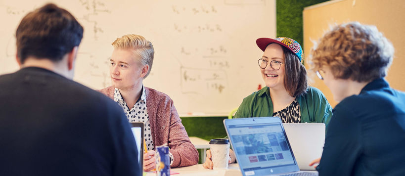 Students in front of whiteboard, photo by Unto Rautio / Aalto Material bank