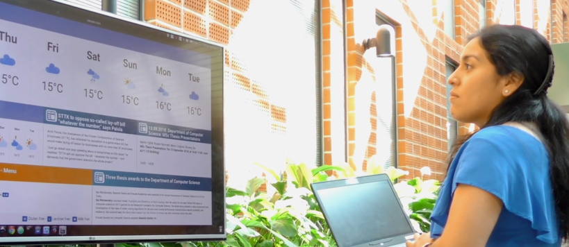 Maria Montoya is establishing an info screen in computer science building at Aalto University