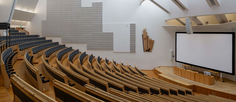 Lecture hall with a white screen