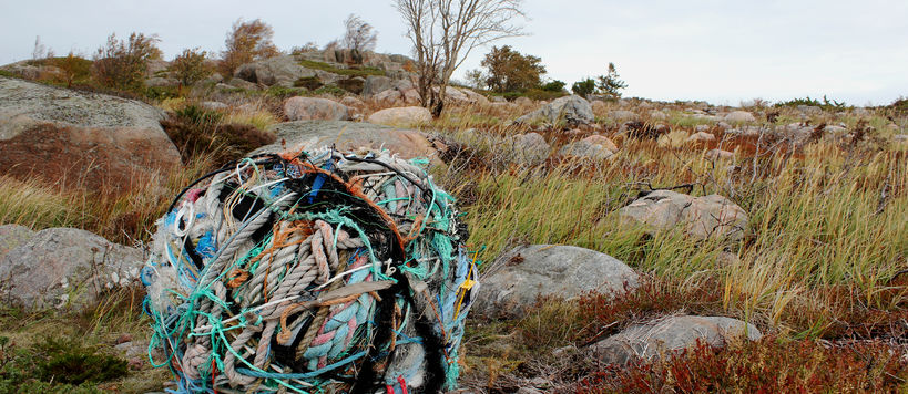 Yarn ball made out of multiple ropes and yarns on top of a rocky hill in Örö Island, 2018.
