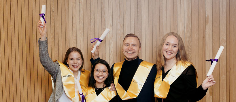 The picture shows Georg Namuth and three other CEMS graduates celebrating at the graduation ceremony. 