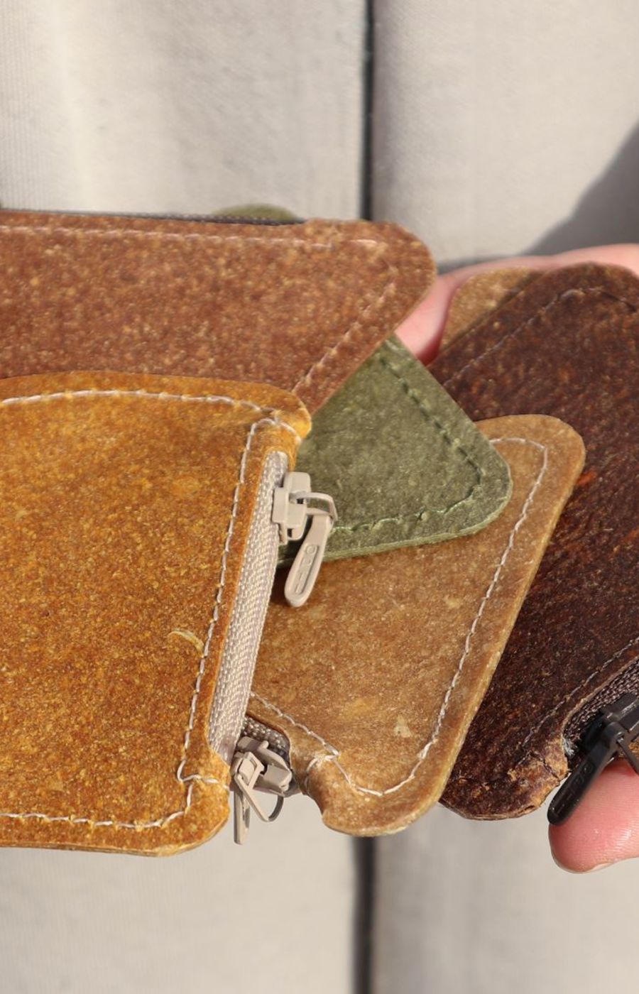 Small coin wallets in different shades of brown